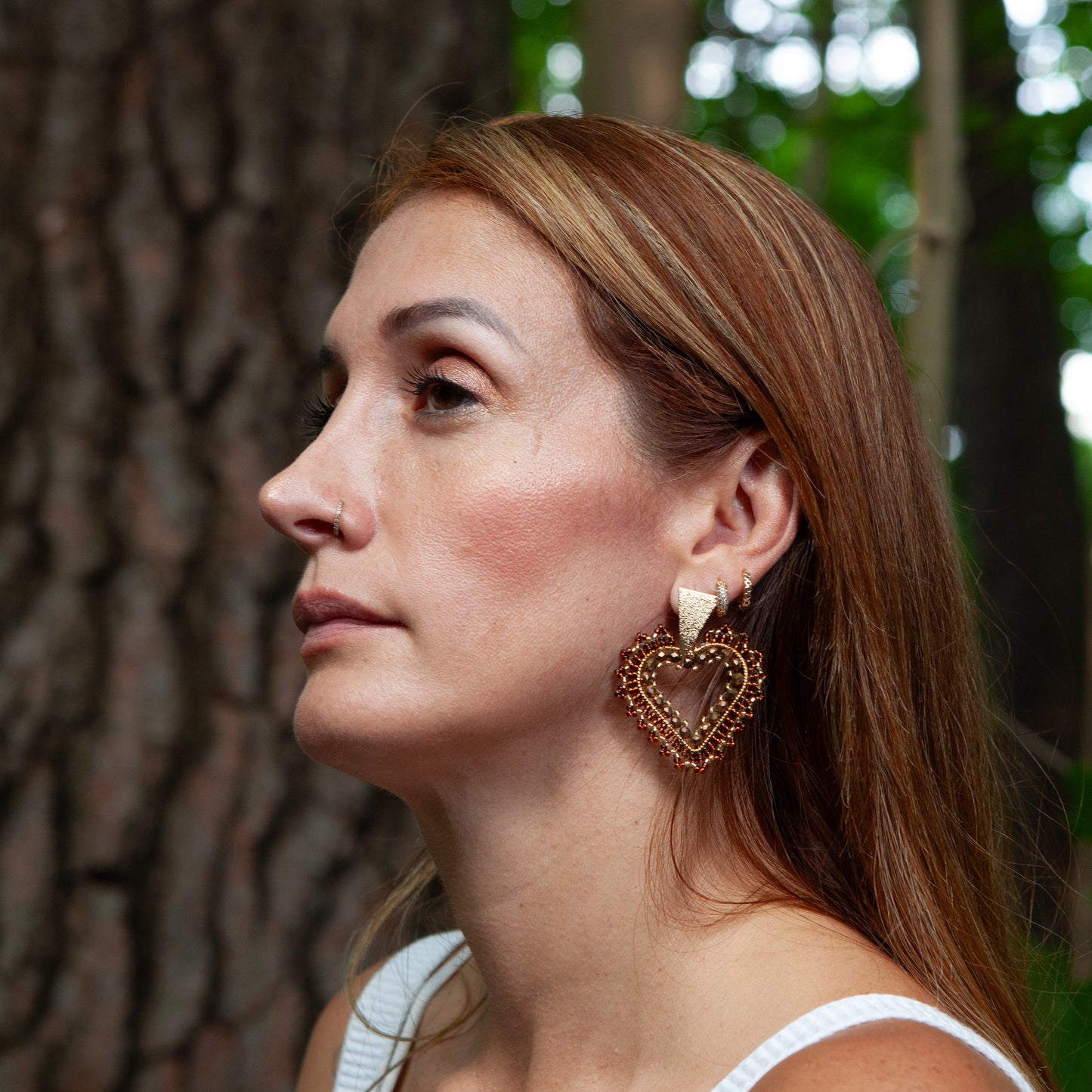 Expertly crafted by hand, our Lovely Heath Earrings feature dazzling beads on delicate wire, accented with a bronze stud and luxurious gold plating. Available in a variety of stunning colors, these earrings are the perfect statement piece for any occasion. Elevate your style with these unique and beautifully designed earrings.