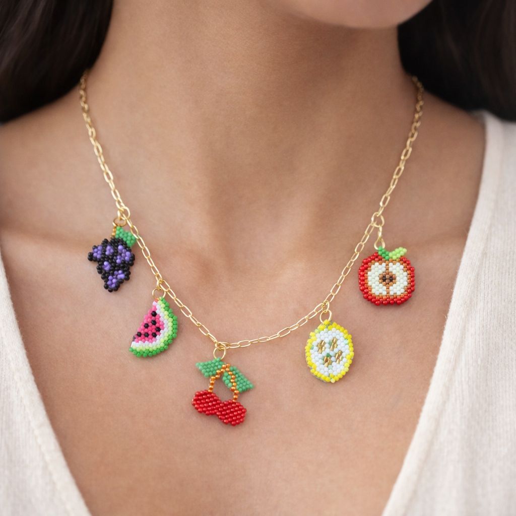 Necklace with colorful fruit charms worn by a person
