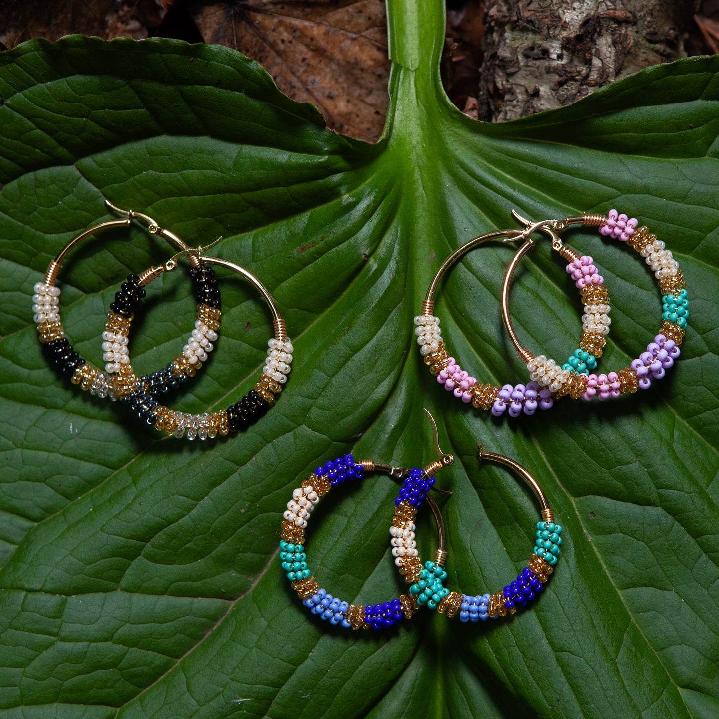 Handmade earrings with beads on wire, featuring a bronze stud with gold plating, available in various colors