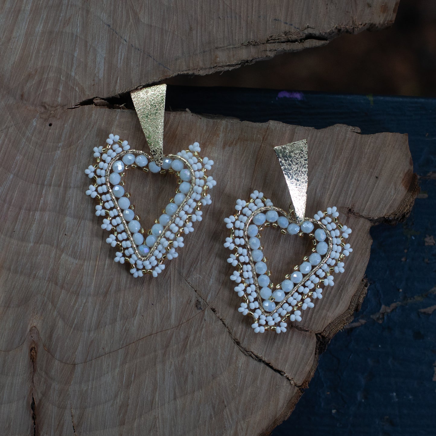 Expertly crafted by hand, our Lovely Heath Earrings feature dazzling beads on delicate wire, accented with a bronze stud and luxurious gold plating. Available in a variety of stunning colors, these earrings are the perfect statement piece for any occasion. Elevate your style with these unique and beautifully designed earrings.