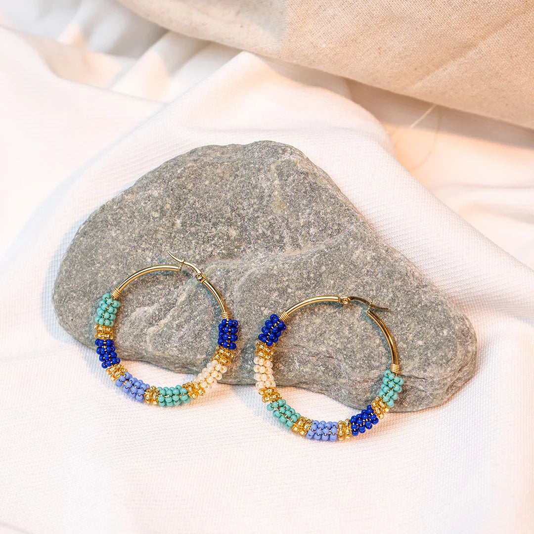 Handmade earrings with beads on wire, featuring a bronze stud with gold plating, available in various colors