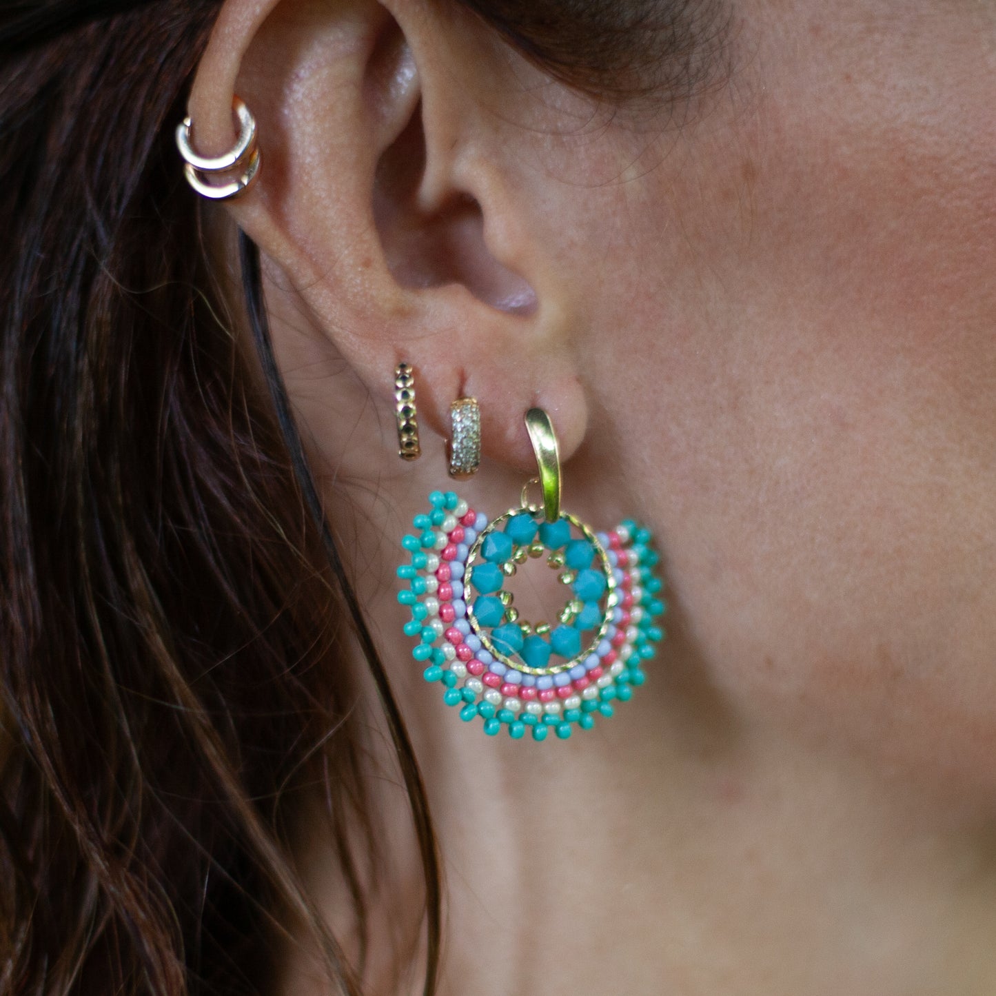  These unique Little Fan-shaped Earrings are handcrafted and designed with intricate wire weaving techniques. Each pair is elegantly adorned with colorful beads and a bronze stud, plated with gold for a luxurious touch. Available in a variety of colors, they are versatile and stylish, perfect for any occasion.