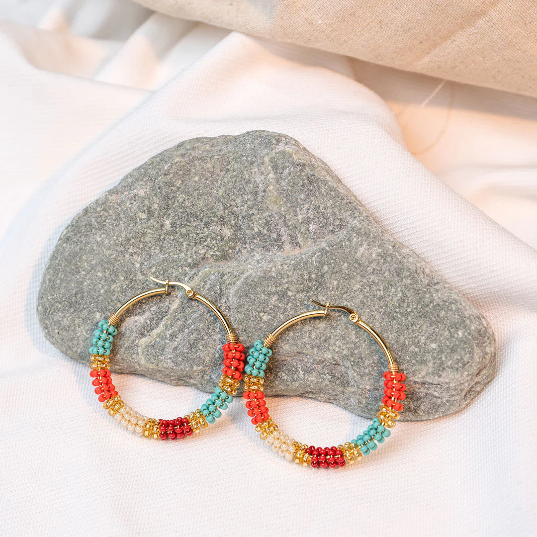 Handmade earrings with beads on wire, featuring a bronze stud with gold plating, available in various colors