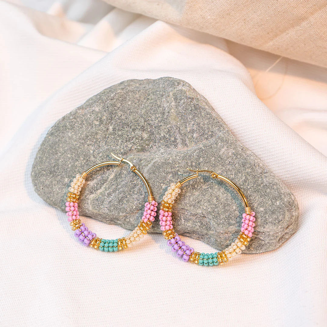 Handmade earrings with beads on wire, featuring a bronze stud with gold plating, available in various colors