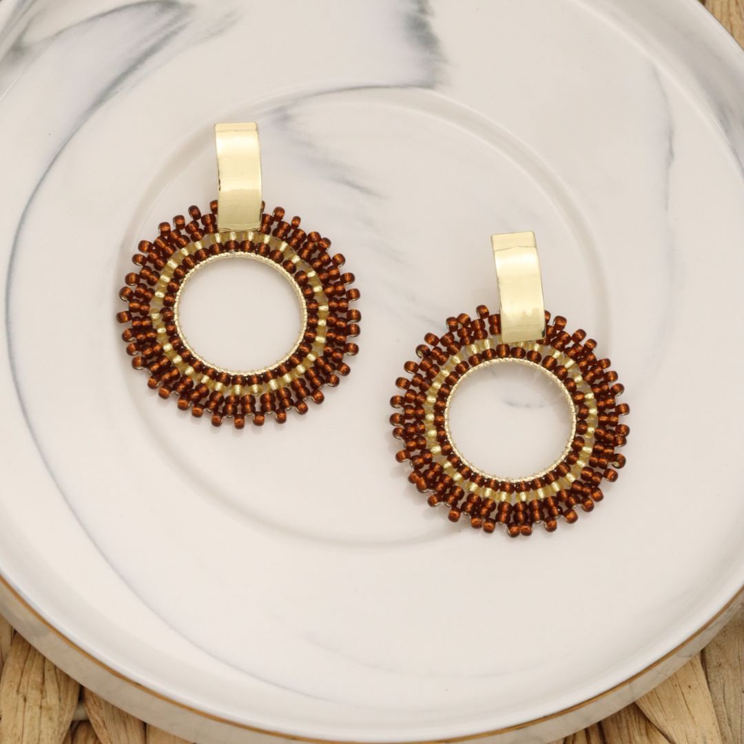 Handmade beaded earrings on wire, featuring a bronze stud with gold plating, available in various colors