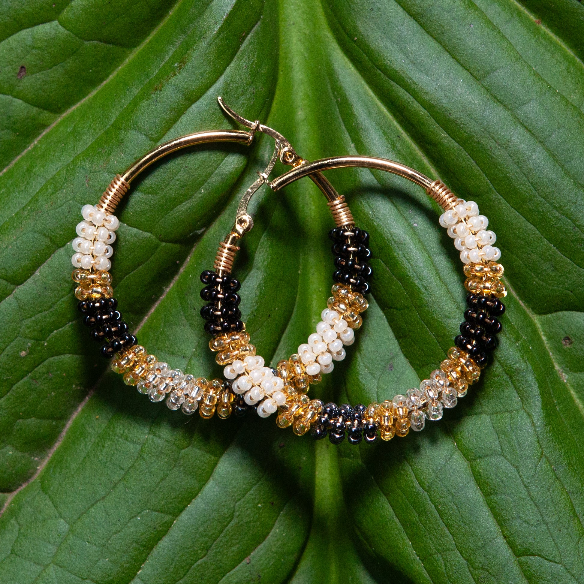 Handmade earrings with beads on wire, featuring a bronze stud with gold plating, available in various colors