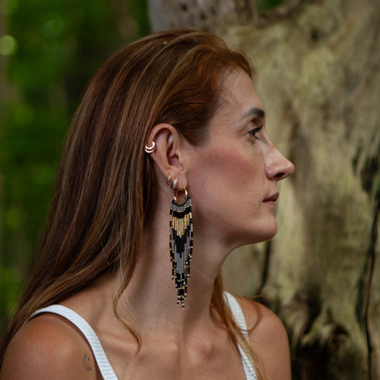 Dangling earrings handmade with beads on wire, featuring a bronze stud with gold plating, available in various colors. Handmade with the highest quality materials, these earrings are truly unique. Each pair features a variety of colors to match any outfit and every occasion.