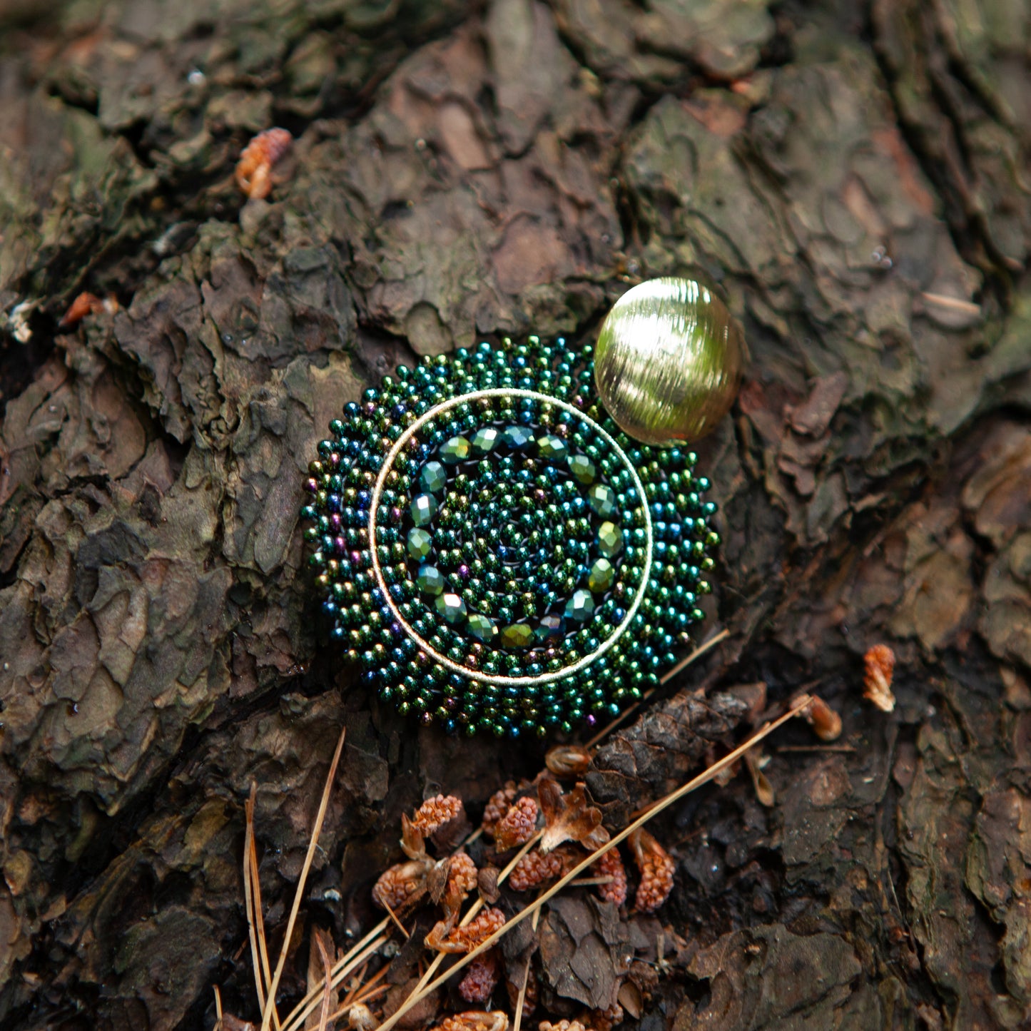 These earrings are handcrafted with colorful beadwork on a delicate wire and feature a bronze stud with a gleaming gold plating, available in a variety of colors.