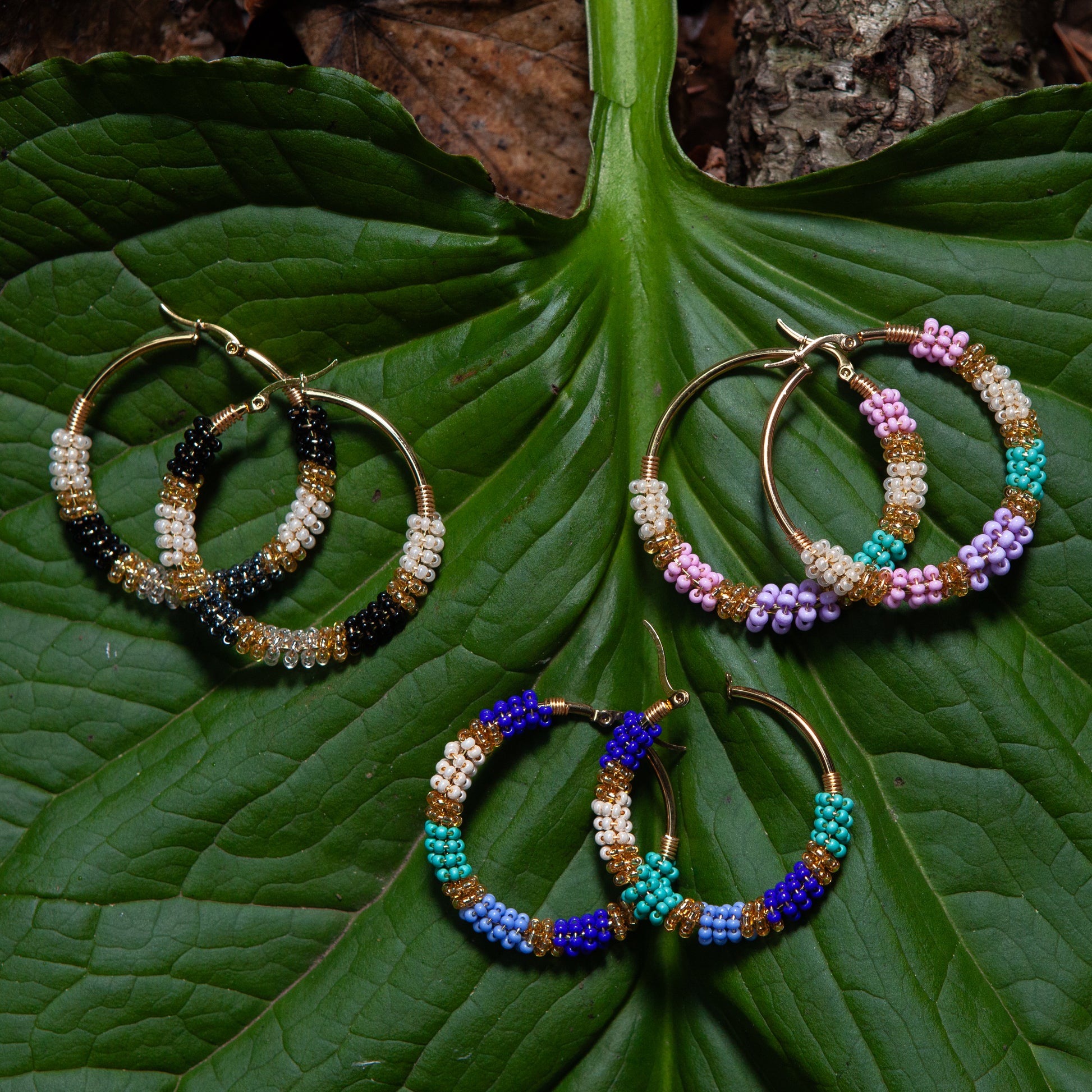 Handmade earrings with beads on wire, featuring a bronze stud with gold plating, available in various colors