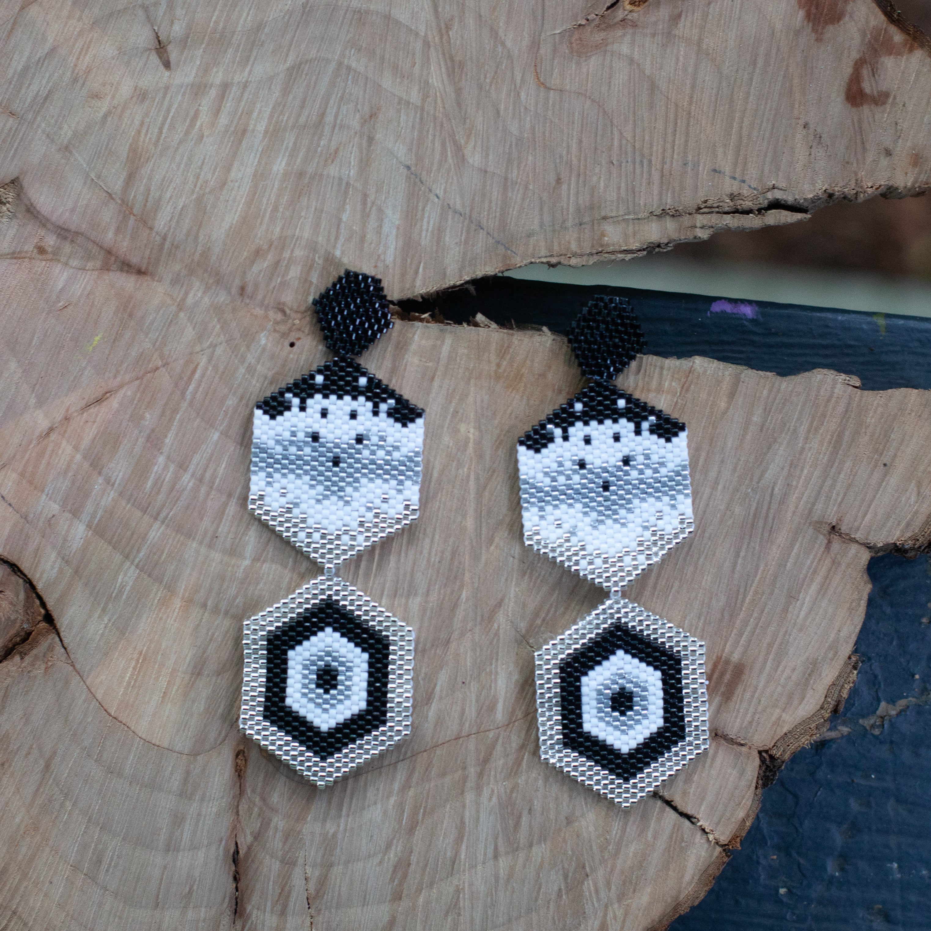 These earrings, handmade with Miyuki beads, are lightweight and comfortable to wear. They feature a bronze stud with gold plating