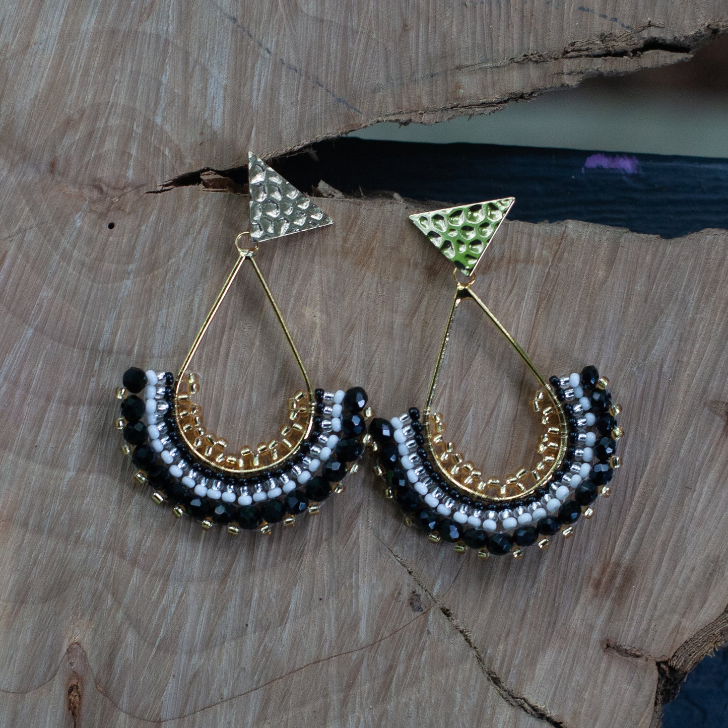Each pair features unique beadwork and a bronze stud with gold plating, available in an array of stunning colors. Elevate your style with our Fan-Shaped Earrings.