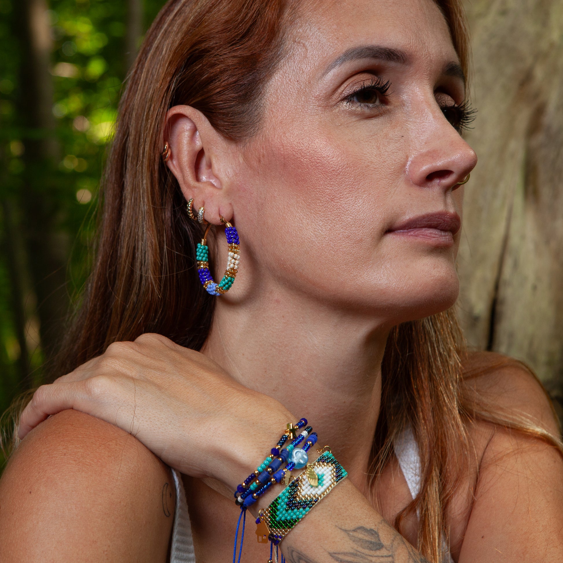 Handmade earrings with beads on wire, featuring a bronze stud with gold plating, available in various colors