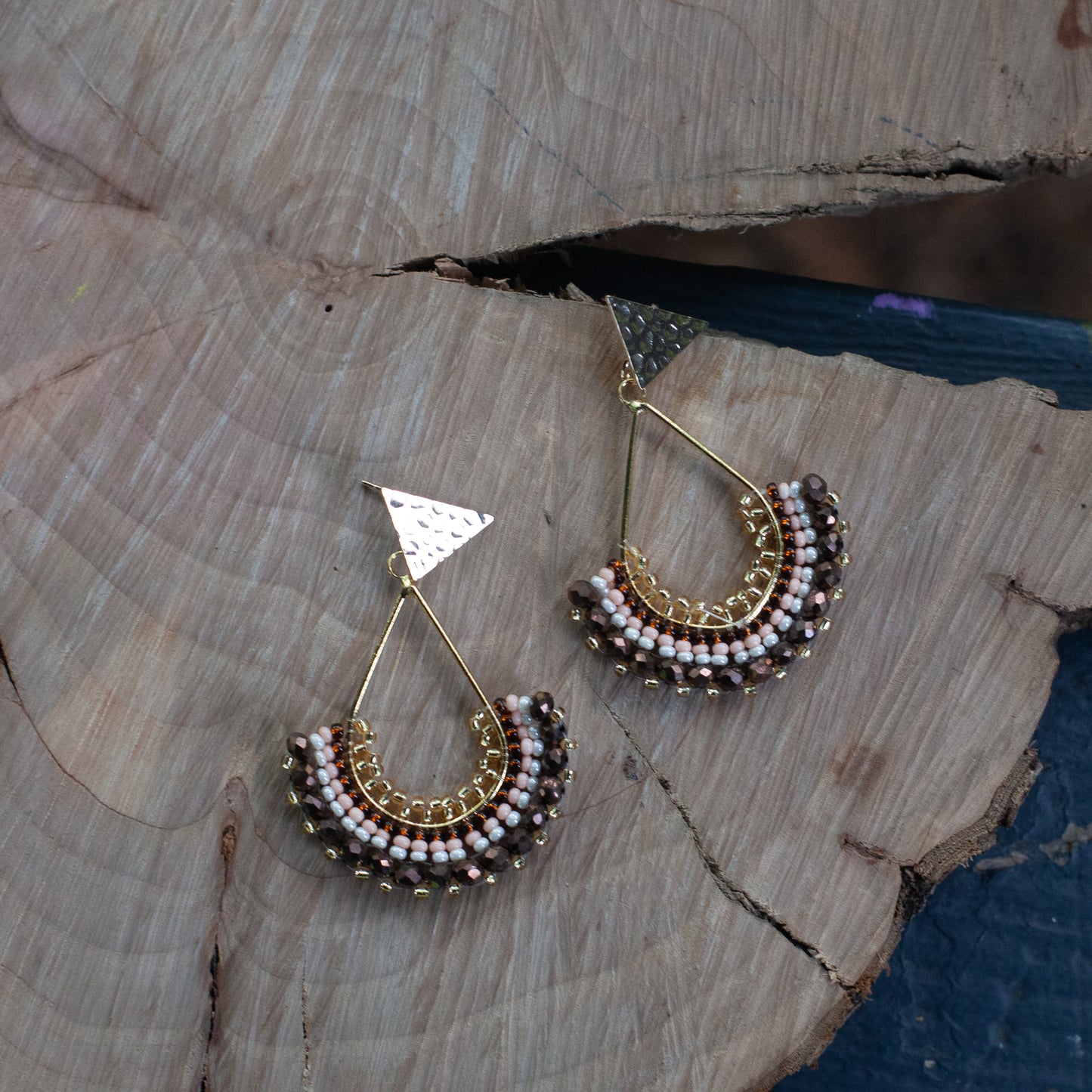 Each pair features unique beadwork and a bronze stud with gold plating, available in an array of stunning colors. Elevate your style with our Fan-Shaped Earrings.