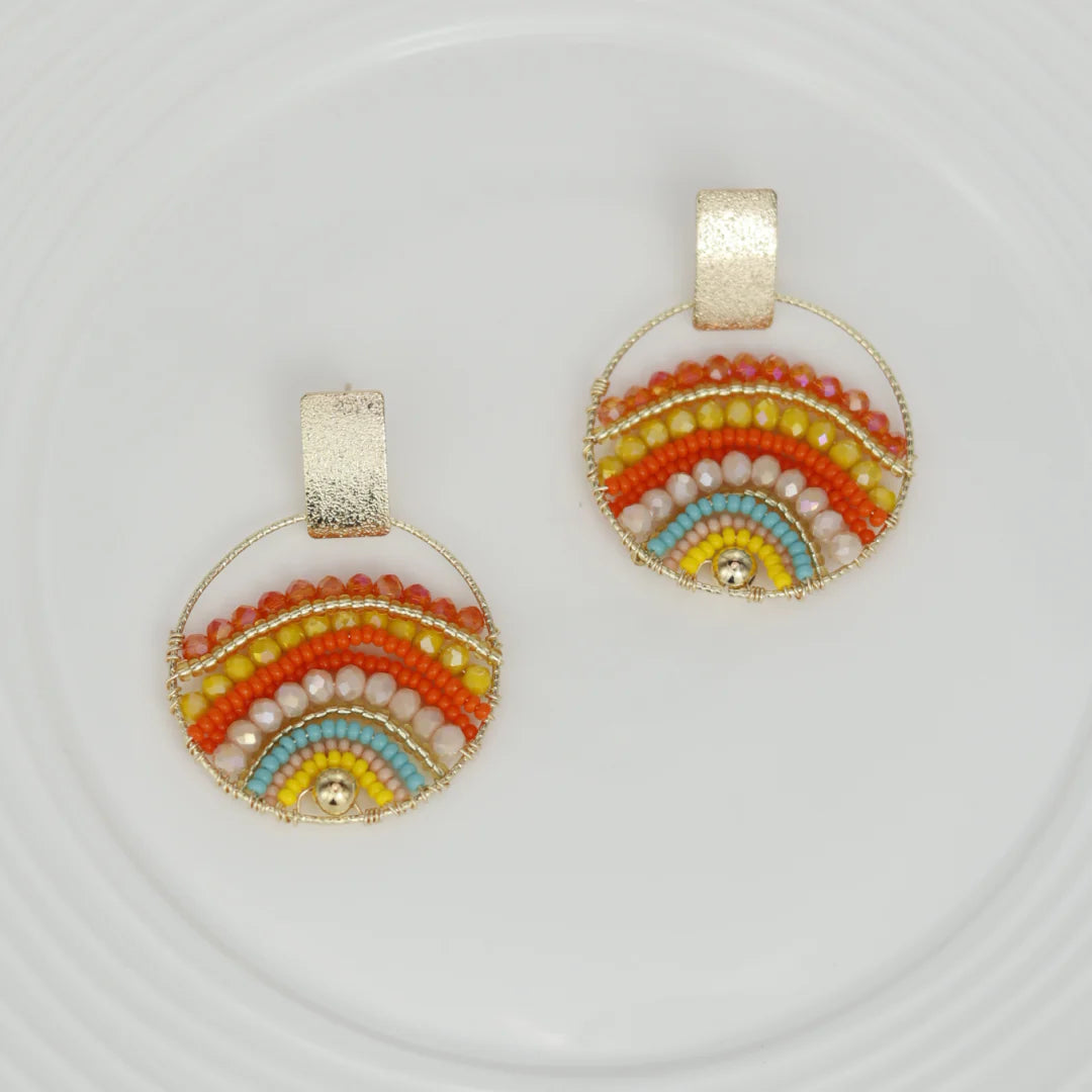Expertly crafted by hand, these Mountains Earrings are a must-have for any fashion-conscious individual. Featuring bronze studs with stunning gold plating and unique beads on wire, these earrings add a touch of elegance to any outfit. Available in a variety of colors, they are the perfect accessory for every occasion.