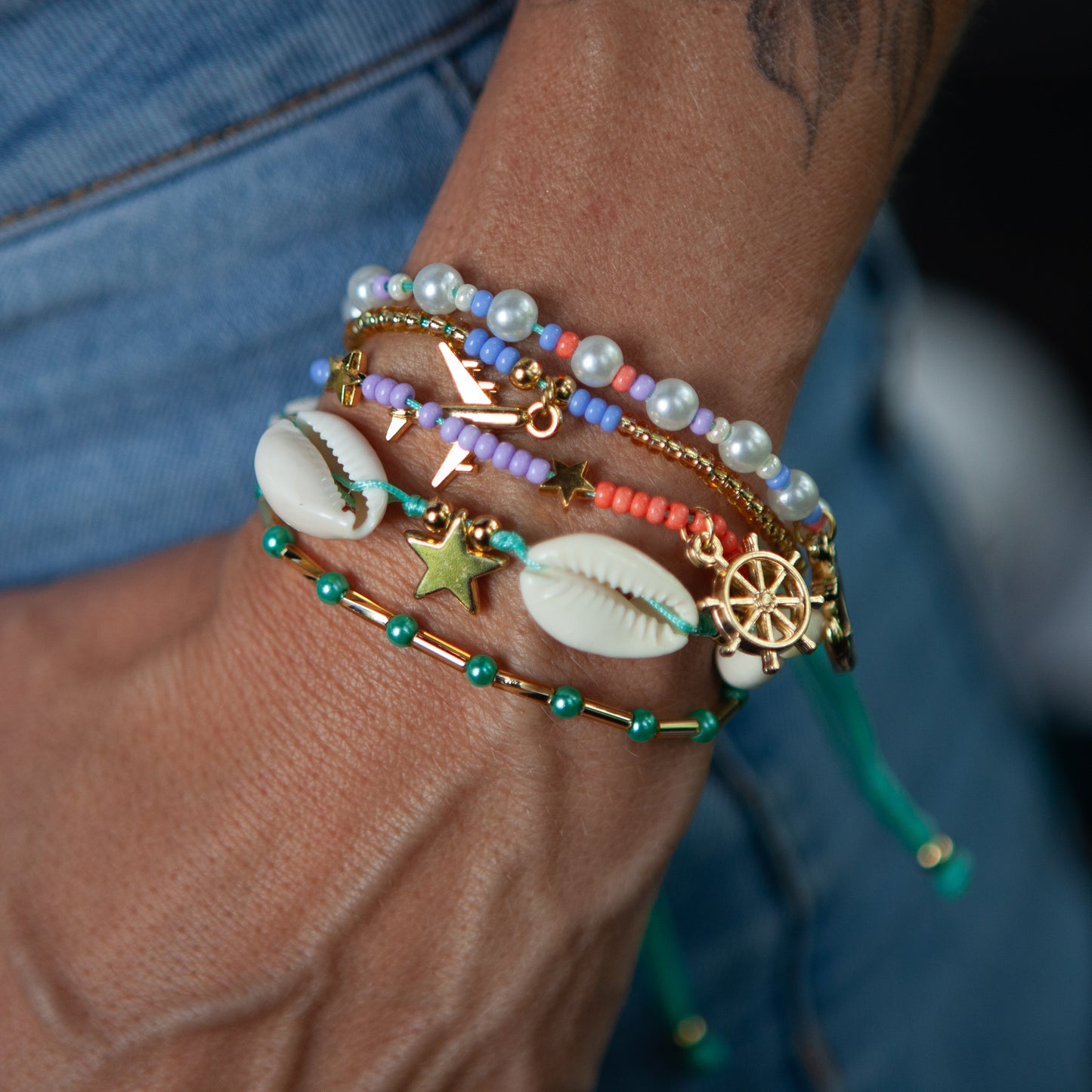 Beautiful Multi-Design Bracelet: Adjustable, Waterproof, Various Designs and Colors The bracelet features over 15 unique designs and colors to choose from. It is also waterproof and adjustable for a comfortable fit that will last over time. With a variety of options, this bracelet is perfect for any style or occasion.
