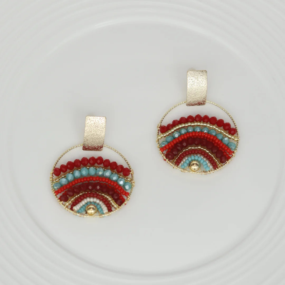 Expertly crafted by hand, these Mountains Earrings are a must-have for any fashion-conscious individual. Featuring bronze studs with stunning gold plating and unique beads on wire, these earrings add a touch of elegance to any outfit. Available in a variety of colors, they are the perfect accessory for every occasion.