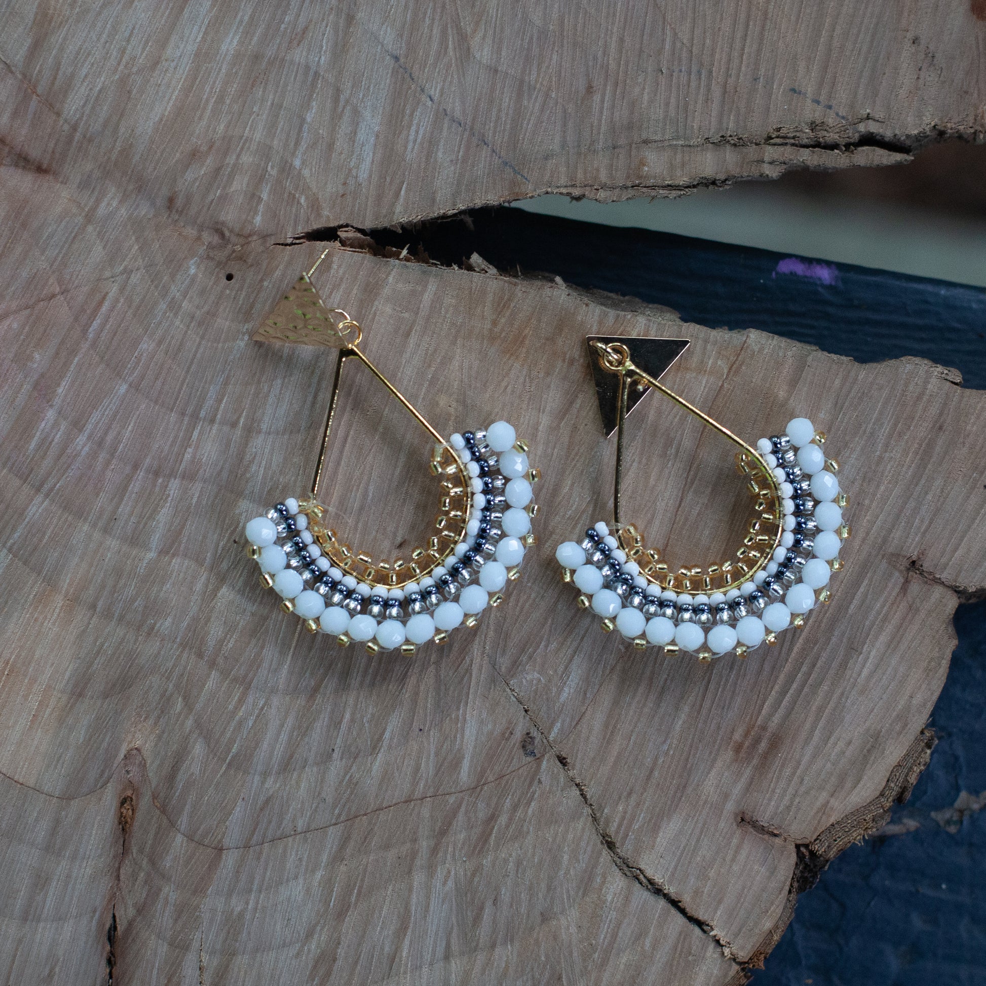 Each pair features unique beadwork and a bronze stud with gold plating, available in an array of stunning colors. Elevate your style with our Fan-Shaped Earrings.